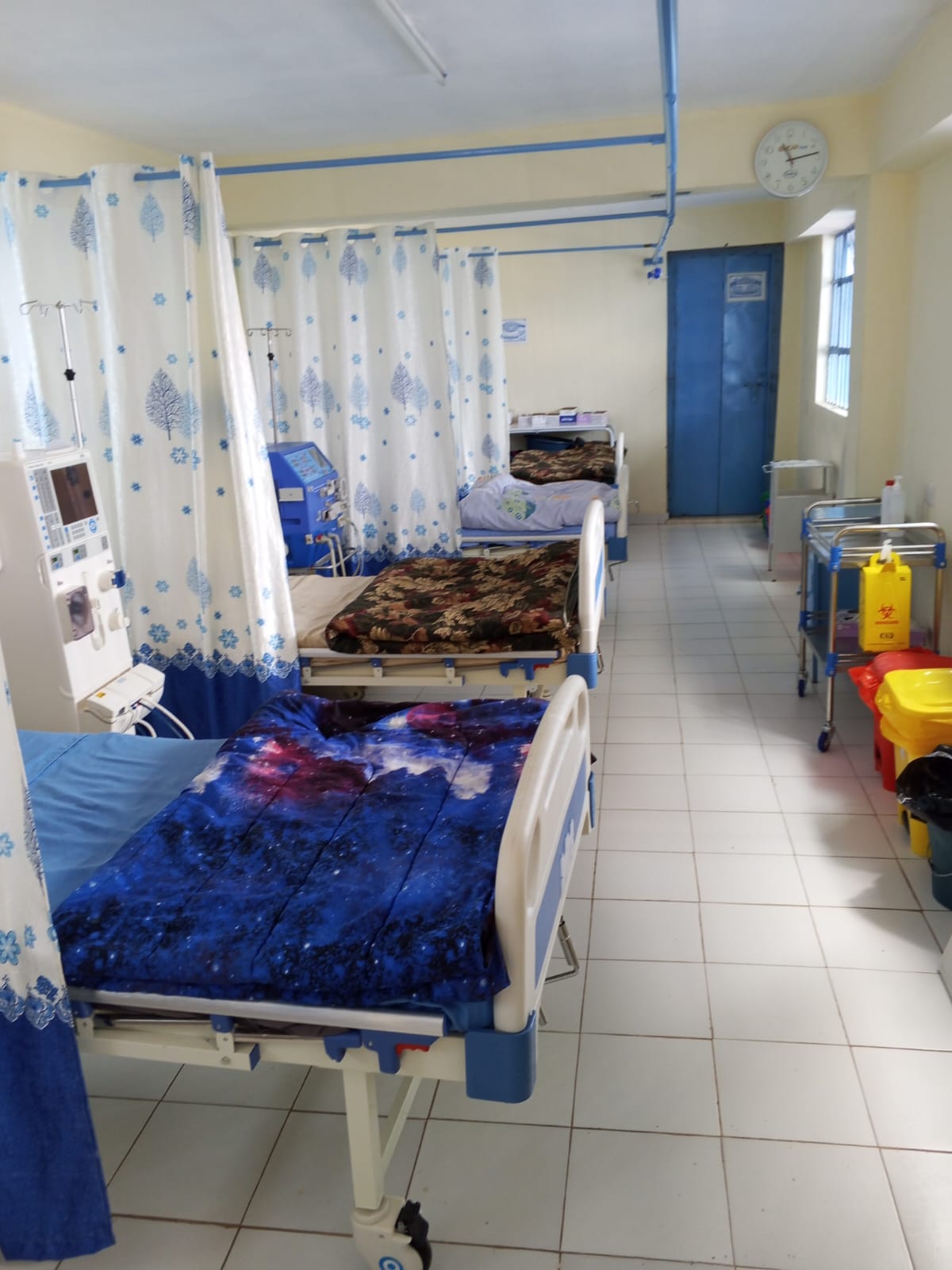Patient ward with hospital beds and equipment